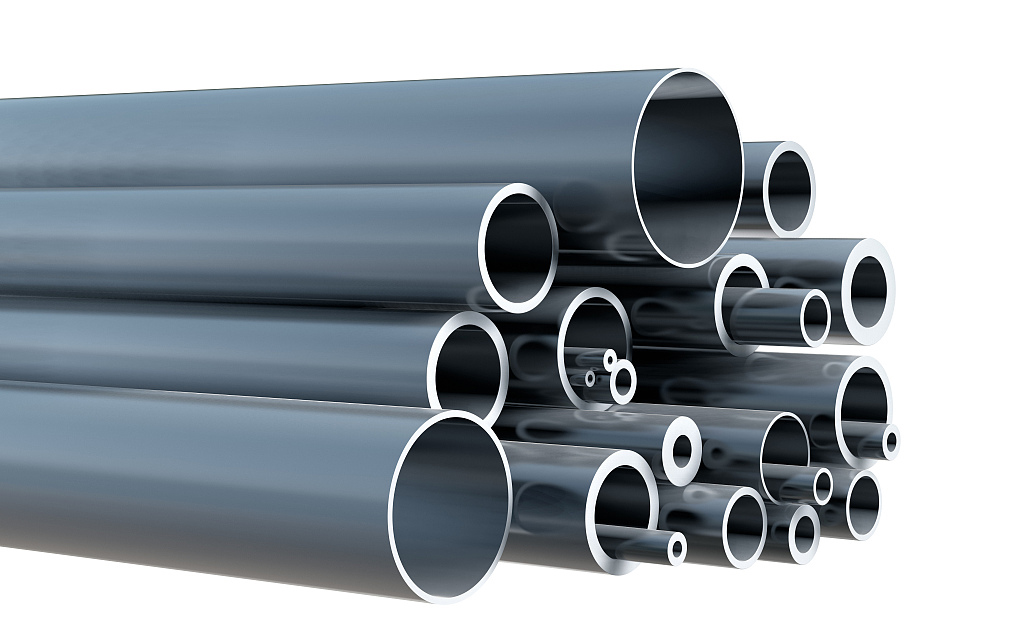 Stack of various steel pipes on white background